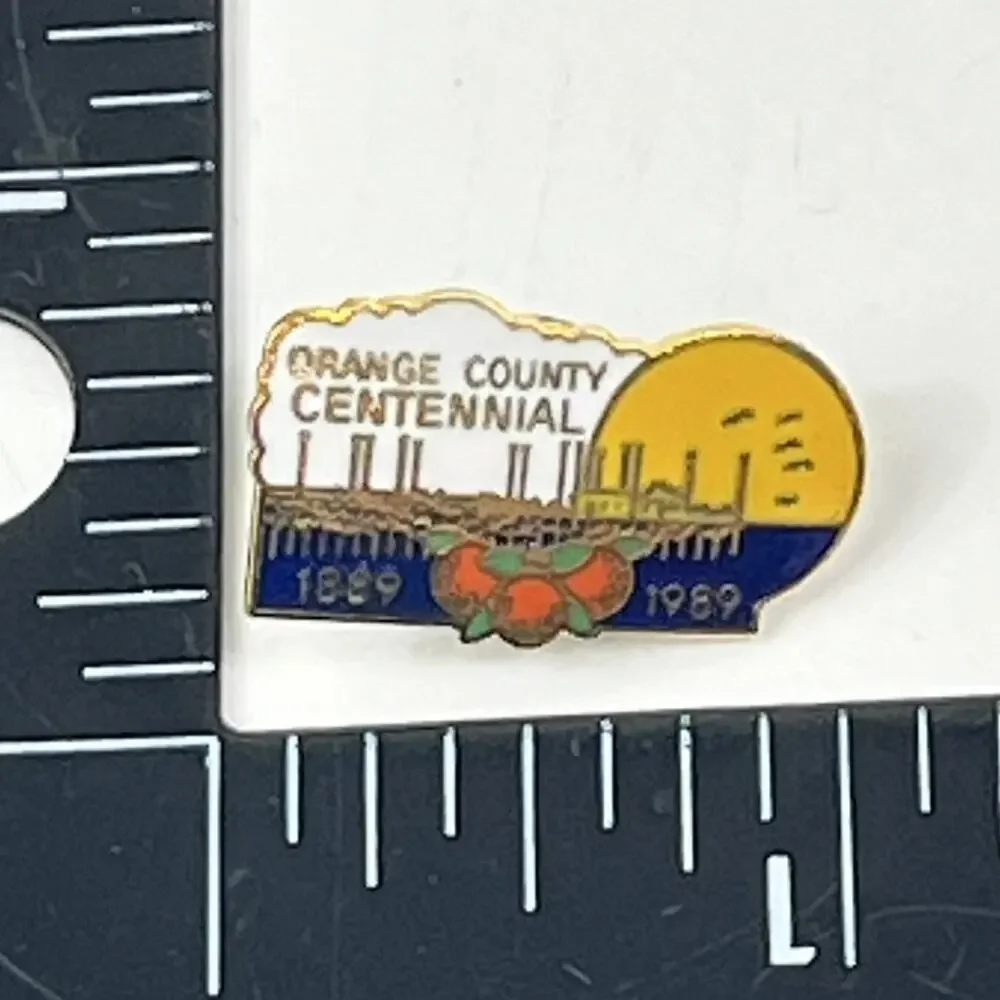 Orange County Centennial 1889–1989 Lapel Pin Gold Tone City Skyline Orange Badge